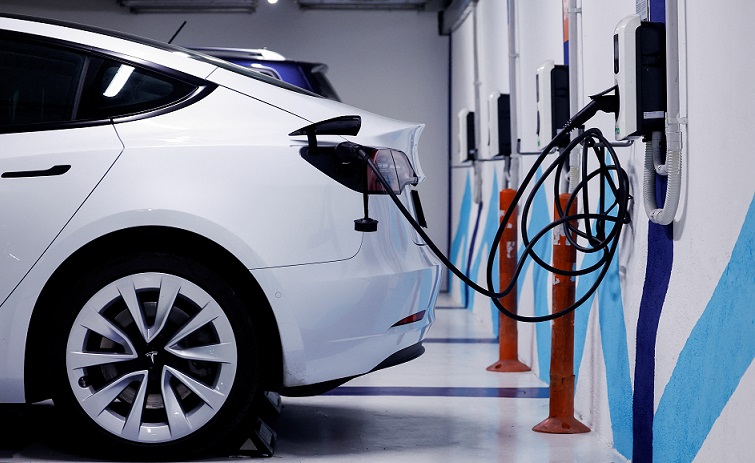 An electric vehicle is plugged into a charging station in Bilbao